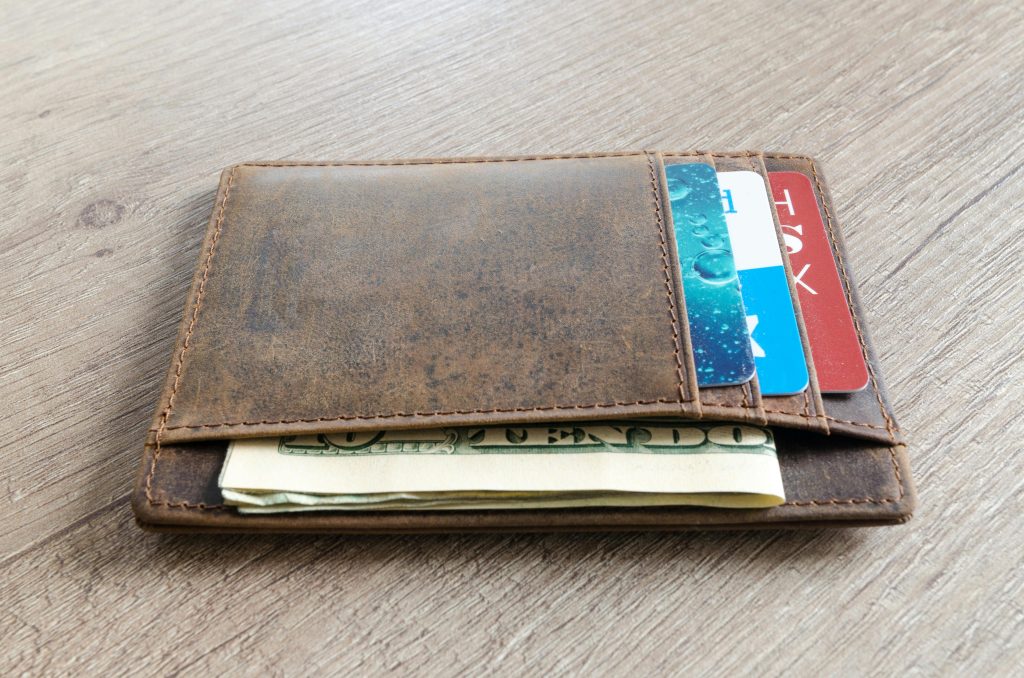 independent artist wallet with money in it